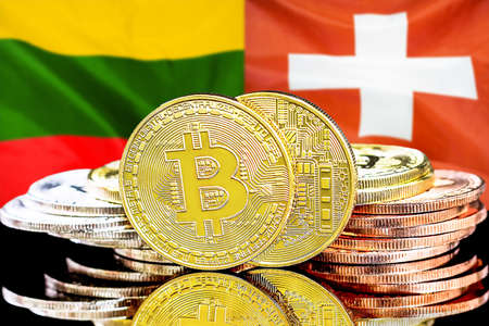 Bitcoins on the background of flag Lithuania and Switzerland. Concept for investors in cryptocurrency and Blockchain technology in Lithuania and Switzerlandの写真素材
