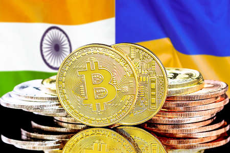 Bitcoins on the background of flag India and Ukraine. Concept for investors in cryptocurrency and Blockchain technology in India and Ukraineの写真素材