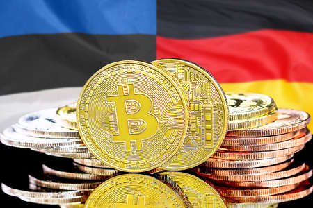 Bitcoins on the background of flag Estonia and Germany. Concept for investors in cryptocurrency and Blockchain technology in Estonia and Germanyの写真素材
