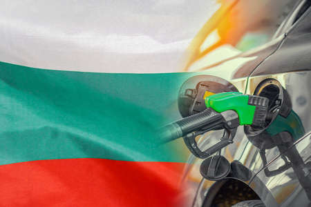 Car with a fuel injector on Bulgaria flag background. Record fuel prices for population. Gasoline price increase during energy and fuel world crisis in Bulgariaの写真素材