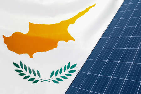 Solar panels against flag Cyprus background. Solar battery generates a pure electricity. Concept of sustainable resources and renewable energy in Cyprusの写真素材