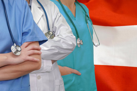 Three Doctors with stethoscope in standing on Indonesia flag background. Close-up medical team. Group of doctors. Innovative technologies in science and medicine, medical developmeの写真素材