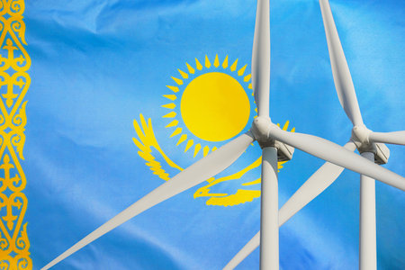 Two Wind Turbines for alternative energy on Kazakhstan flag background. Energy development and energy crisis. Eco power and wind stations for renewable electric energy production in Kazakhstanの写真素材