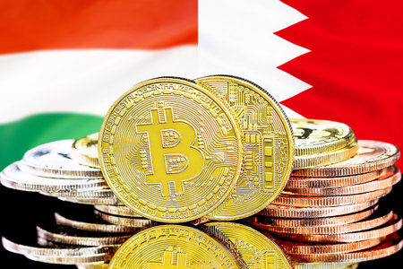 Bitcoins on flag Bahrain and Hungary background. Concept for investors in cryptocurrency and Blockchain technology in Bahrain and Hungaryの写真素材