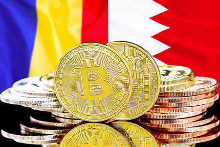 Bitcoins on flag Bahrain and Moldova background. Concept for investors in cryptocurrency and Blockchain technology in Bahrain and Moldovaの写真素材