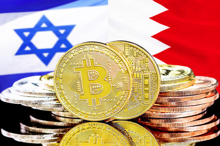Bitcoins on flag Bahrain and Israel background. Concept for investors in cryptocurrency and Blockchain technology in Bahrain and Israelの写真素材