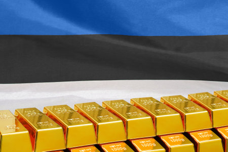 Row of shining golden bullions on the Estonia flag background. Business and financial country's reserves. Concept of gold reserve and gold fund of Estoniaの写真素材