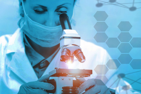 Young scientist studying new substance or virus in microscope. Science and medicine, scientist...