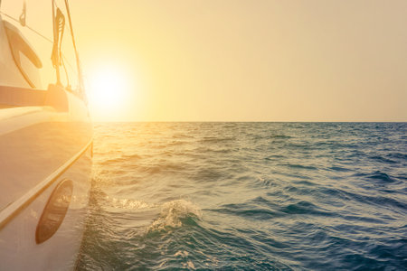 Sailing yacht against sunset. Luxury yachts.Yacht Sailing against sunset. sailboat. Yachting....