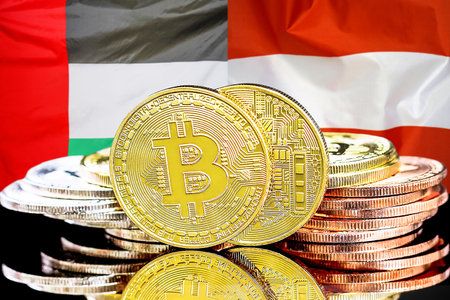 Bitcoins on flag of United Arab Emirates and Austria flag background. Concept for investors in cryptocurrency and Blockchain technology in UAE and Austriaの写真素材