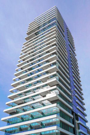 Modern residential area, new apartment building in the city. Windows office building for background....