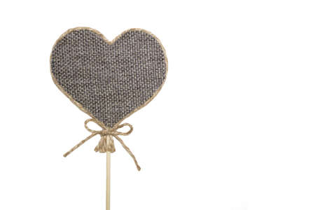 Handmade heart on a stick on a white background.の写真素材