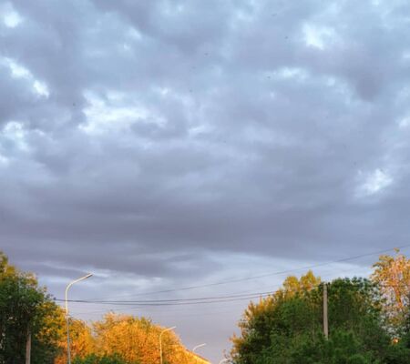 blue bright sky with white clouds in the cityの写真素材