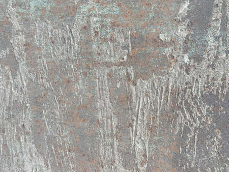 Rusty metal wall, old sheet of iron covered with rust with multi-colored paint
