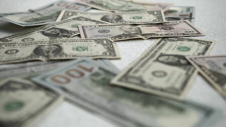 American dollars lie on a bright shiny background.High quality Dollar banknotesの写真素材