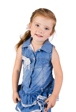 Portrait of cute smiling little girl in dress  isolatedの写真素材