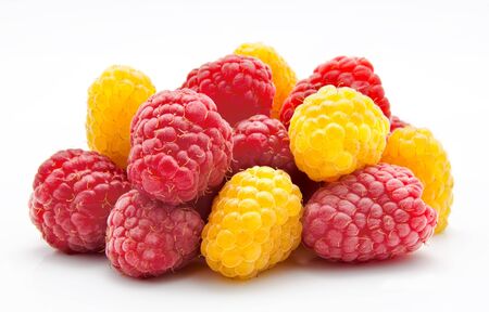 Heap of red and yellow raspberry on a whiteの写真素材