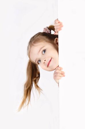 Smiling cute little girl isolated on whiteの写真素材