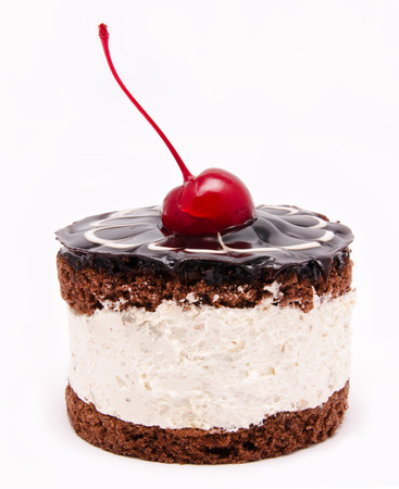 Chocolate cake with cherry on the top icing isolated on a white backgroundの写真素材
