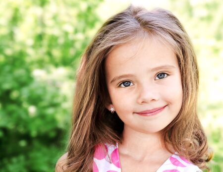 Portrait of adorable smiling little girl outdoor