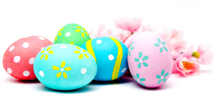 Colorful handmade easter eggs with flower isolated on a white