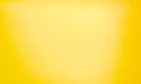 Abstract yellow background with spotlight  paper textureの写真素材