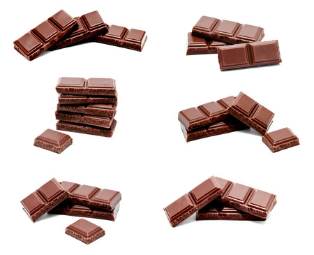 Collection of photos dark milk chocolate bars stack isolated on a white backgroundの写真素材