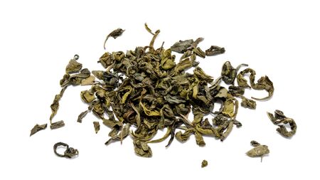 Heap of chinese green tea isolated on a white background