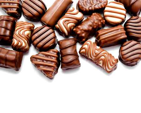 Assortment of chocolate candies sweets isolated on a white backgroundの写真素材