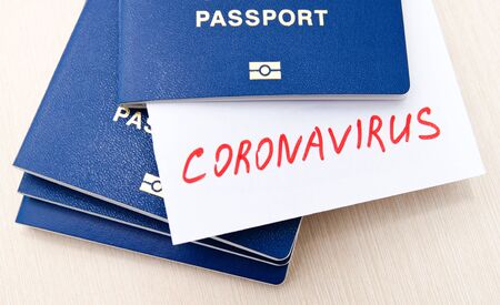 Coronavirus and travel concept. Note COVID-19 coronavirus and passport.