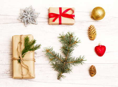 Merry Christmas and Happy New Year composition. Christmas gift, balls, pine cones, fir branches on...