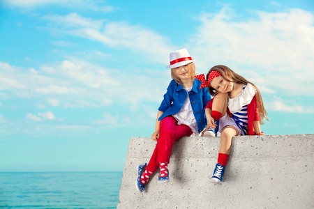 Fashion kids resting on the sea   Vacation, friendship, fashionable concept の写真素材