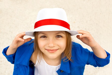 Smiling cute little girl in white hat  Happiness, fashionable concept の写真素材