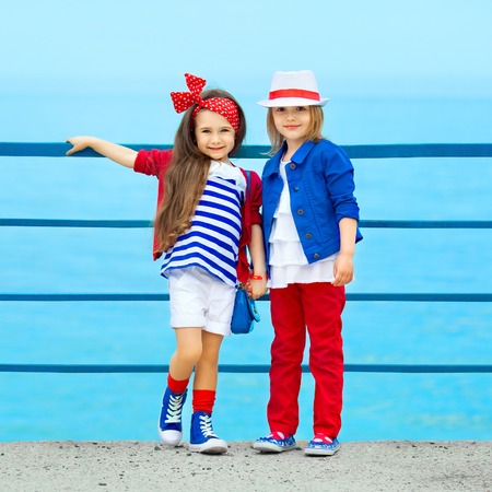 Fashion kids resting on the sea   Vacation, friendship, fashionable concept の写真素材
