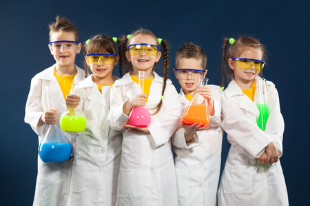 Group happy kids doing experiments in the laboratory. Science and education.の写真素材