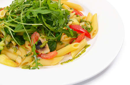 pasta with vegetables and salad close upの写真素材