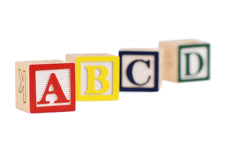 Wooden cubes with letters isolated on whiteの写真素材