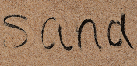 The sand on the black background close-upの写真素材