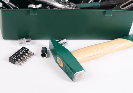 Box with construction tools isolated on whiteの写真素材