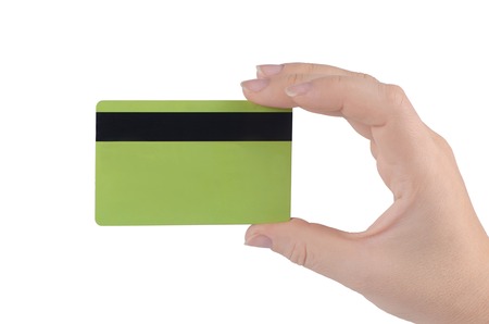 Credit card in hand  isolated on whiteの写真素材