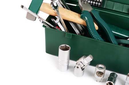 Box with construction tools isolated on white