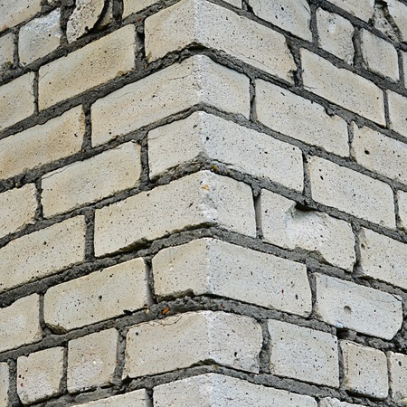 Corner wall from a white brick close-upの写真素材