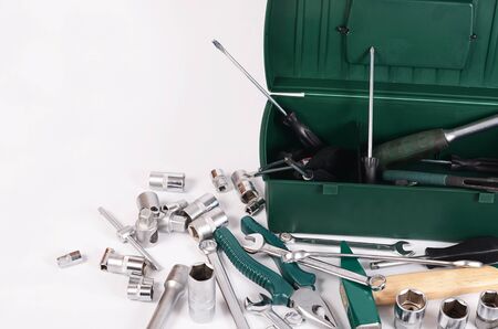 Box with construction tools isolated on whiteの写真素材