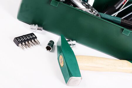 Box with construction tools isolated on whiteの写真素材