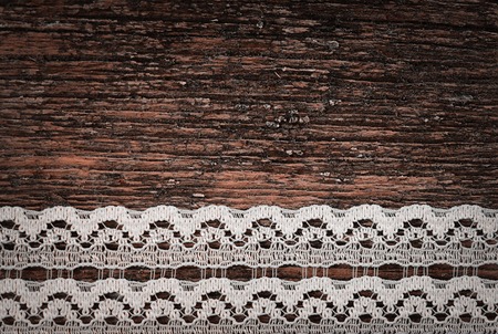 The openwork lace on a wooden backgroundの写真素材