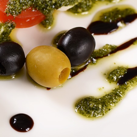 The omatoes and mozzarella cheese sliced olivesの写真素材