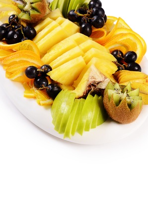 Slicing fruit with pineapple, orange and grapesの写真素材