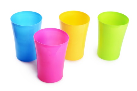 Plastic colorful cups isolated on white backgroundの写真素材