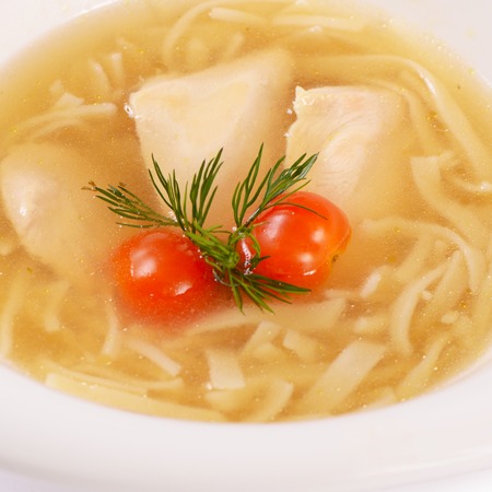 Soup homemade noodles with chicken close upの写真素材