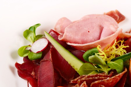 Assorted Italian sausages close-up as a backgroundの写真素材